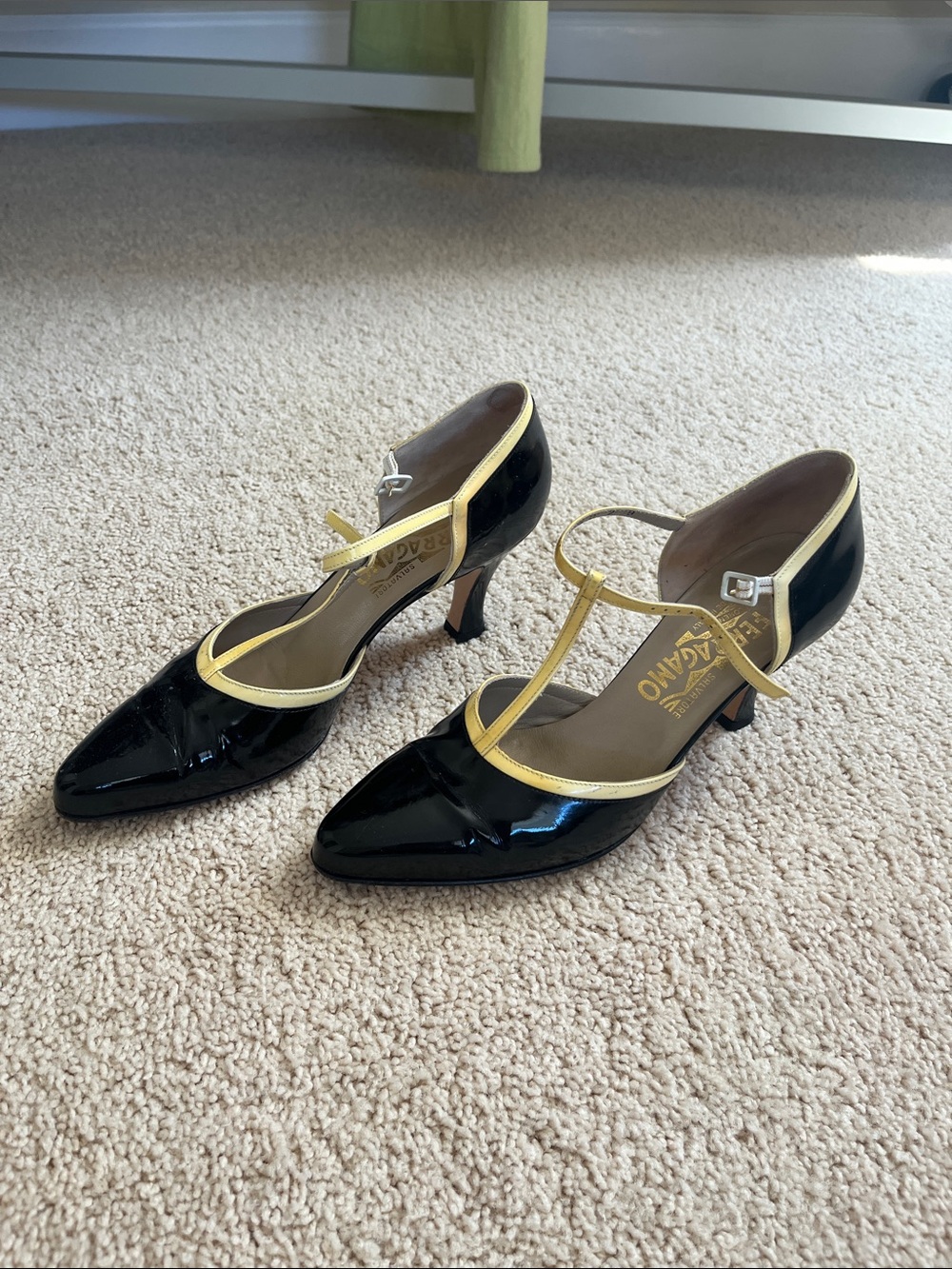 Salvatore Ferragamo Black and Gold Patent T-Strap Pumps